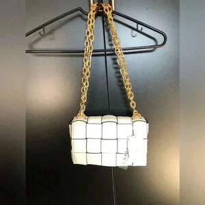 Eleganza White vegan leather pocketbook, gold shoulder chain, black trim, clasp